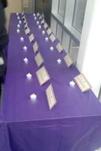 The table featured stories of the 19 people in MA lost to domestic violence homicide in the past year.